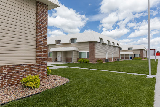 Prairie View townhome buildings with green lawns and covered entries