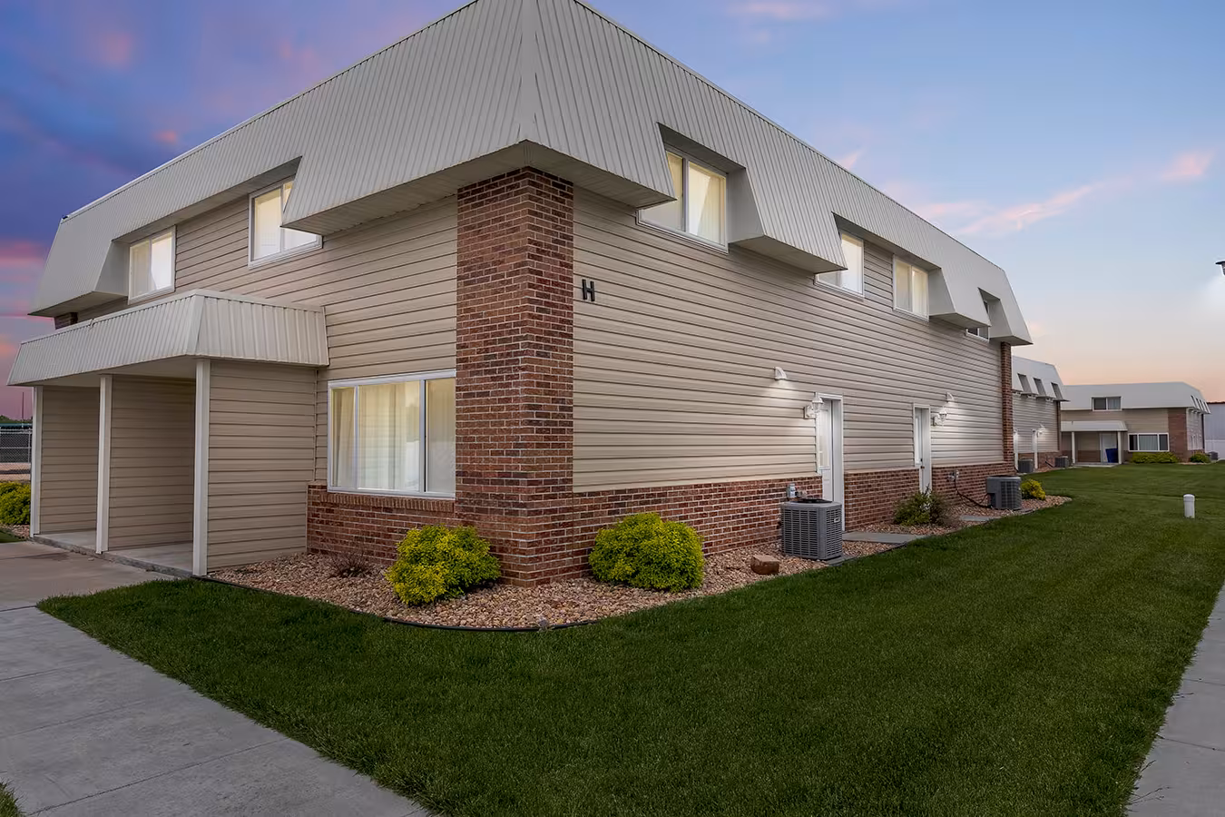 Prairie View townhome building at dusk