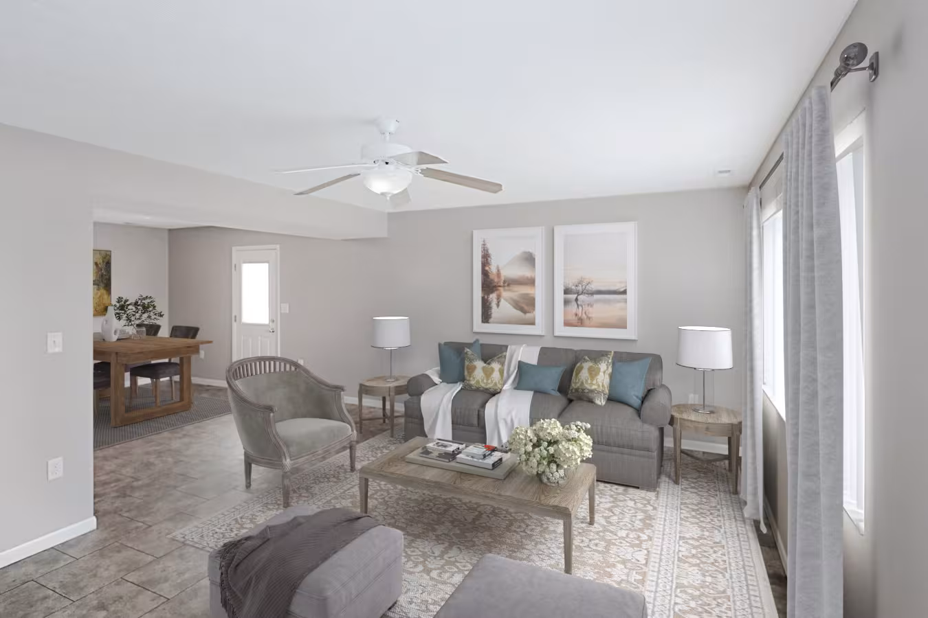 Living room with a ceiling fan and space for a dining table