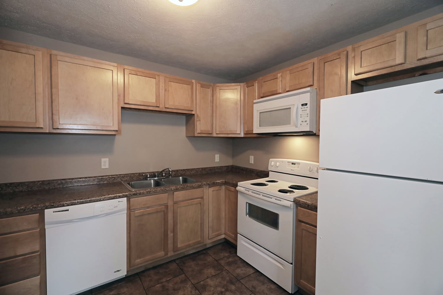 Townhome kitchen with a full set of appliances and plenty of cabinet space